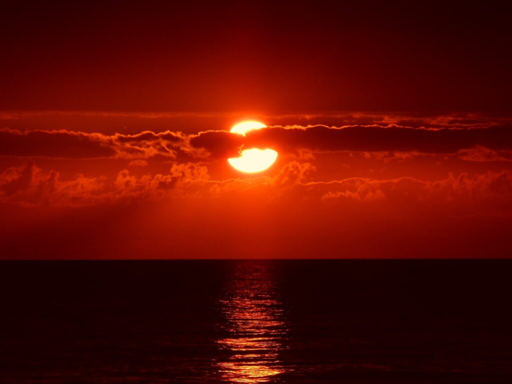 What Does a Red Sun Symbolize in Spirituality?